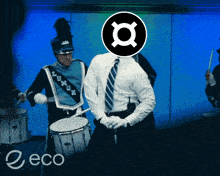 a man in a marching band has a logo on his head that says x on it
