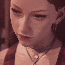 a close up of a woman 's face wearing a choker and earrings