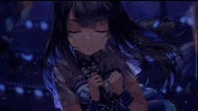 a girl with long black hair is holding a microphone with a sticker on it that says ' nc '