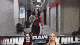 a woman holding a wrestling championship is walking down a hallway with the words raw tonight on the bottom