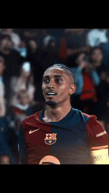 a soccer player wearing a shirt that says ambassa