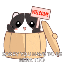 a black and white cat is holding a welcome sign