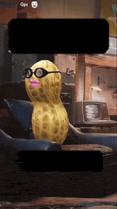 a peanut wearing glasses is sitting on a couch