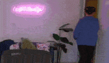 a person in a blue hoodie is standing in front of a pink neon sign that says off duty