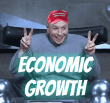 a man wearing a red hat that says make america great again gives a peace sign