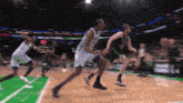 a blurry picture of a basketball game with a player wearing a jersey with the number 22 on it