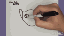 a person is drawing a cat with a marker with the words draw cute things written above it
