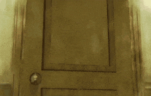 a girl with pink hair is standing in a doorway holding a door knob