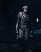 a blurry image of a person standing in the dark with their arms outstretched