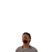 a man with glasses and a beard looks up at a green x on his head