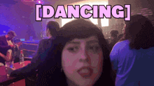 a woman in a club with the word dancing written above her