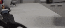 a person is sitting at a desk with a keyboard and mouse on it .