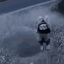 a person is standing next to a rocket that is being launched into the air .