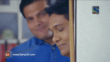 a sony television advertisement shows two men peeking out from behind a door