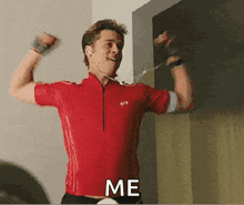 a man in a red shirt is flexing his muscles and the word me is next to him