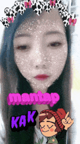 a girl with a cow print crown on her head has a sticker on her face that says ' mantan kak '
