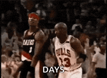 a basketball player wearing a bulls jersey is running across the court .