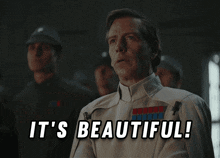 a man says it 's beautiful in front of a group of soldiers