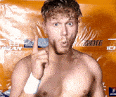 a shirtless man giving a thumbs up in front of a poster that says buy tickets now