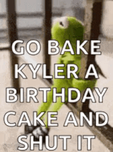 kermit the frog is sitting on a railing with a birthday cake and shut it .