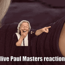 a man is laughing and pointing with the words live paul masters reaction