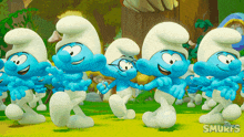 a group of smurfs are dancing in a cartoon scene
