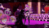 a video game screen shows a man and a woman dancing on a stage