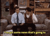 two men are sitting on a couch and one of them is saying i 've got some news that 's going to .