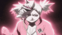 a girl in a pink jacket with a skull on her head .