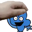 a hand is putting a blue cartoon character on top of a blue cartoon character .