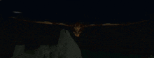 a bat is flying in the dark with its wings outstretched .