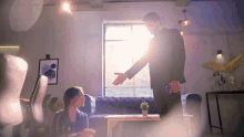 a man in a suit reaches out to shake a woman 's hand