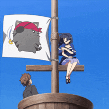 a pirate flag with a cat on it is hanging from a wooden pole