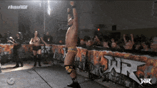 a man in a wrestling ring with the word wr on it