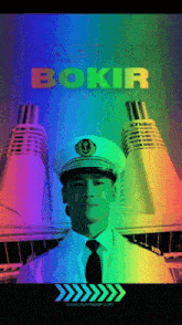 a man in a captain 's hat is standing in front of a ship with the words kapten bokir above him