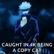 a man is taking a selfie with a cell phone and the caption says caught in 4k being a copy cat .