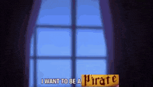 a window with a sign that says i want to be a pirate on it