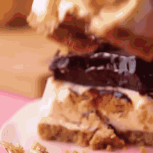 a close up of a piece of cake on a pink plate