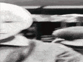 a black and white photo of a person with a white head .