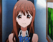 a girl with long brown hair is wearing a blue and yellow tie