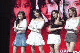 a group of women standing in front of a screen that says ' subscribe here '