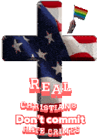 a cross with the words real christians don 't commit hate crimes