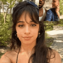 a woman wearing earrings and a necklace is looking at the camera