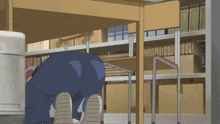 a person is crawling under a desk in a room
