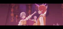 a boy and a girl are standing next to each other in a dark room .