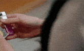 a person is holding a lighter in their right hand