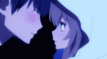 a boy and a girl are looking at each other in a dark room .