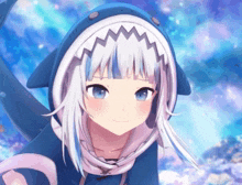 a girl with a shark hood on her head is smiling