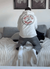 a man wearing a white hoodie that says dolce vita predator