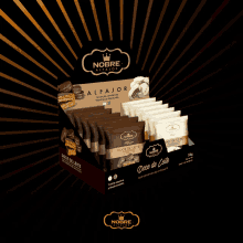 two bags of nobre are displayed with gold stars behind them